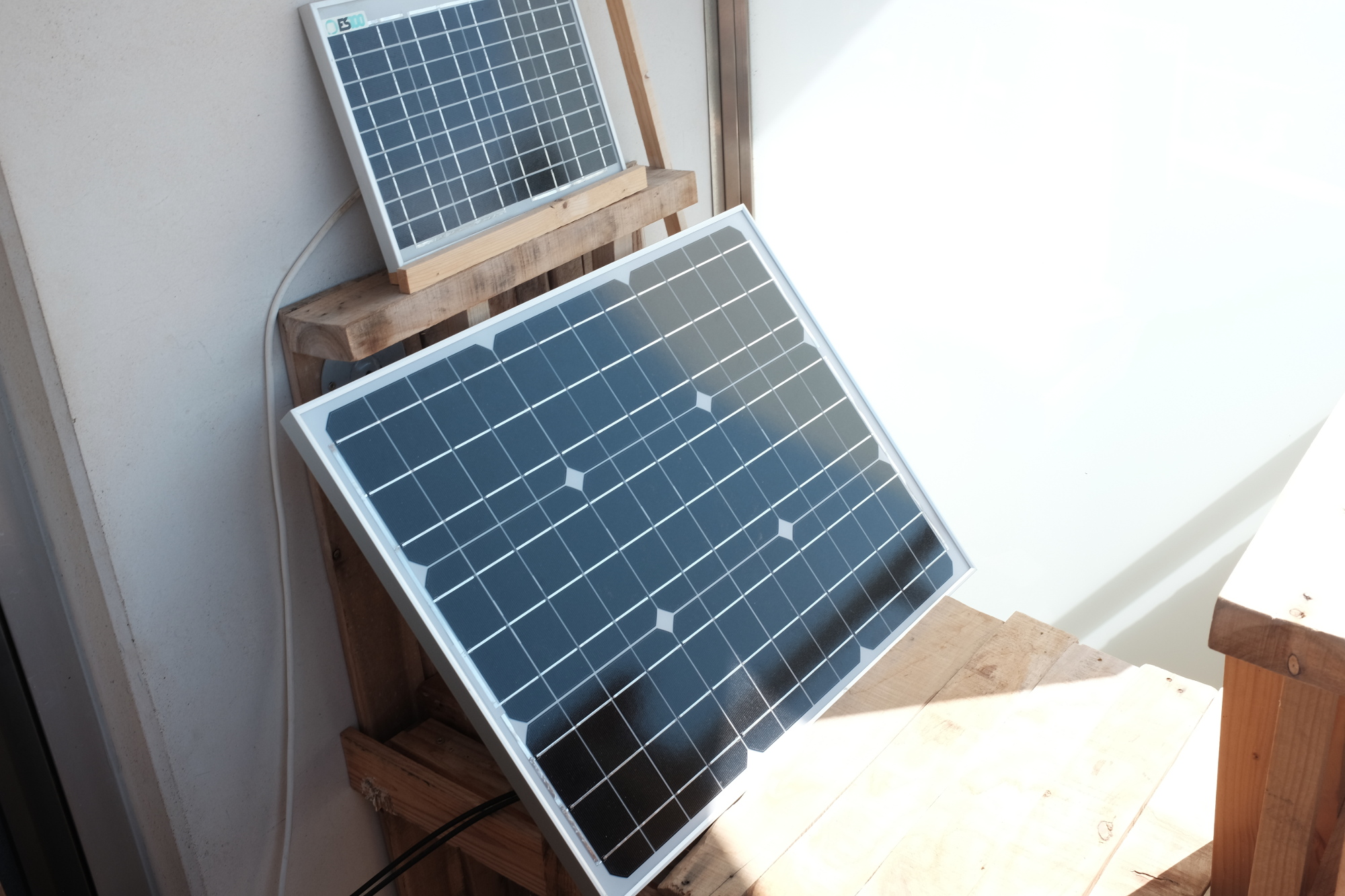 The 50W panel, on top of it is a 10W panel of a previously built off-grid lighting system.